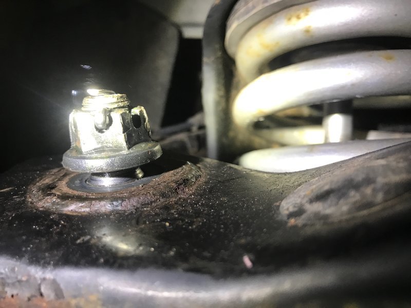 Gap between Upper control arm and ball joint castle nut World