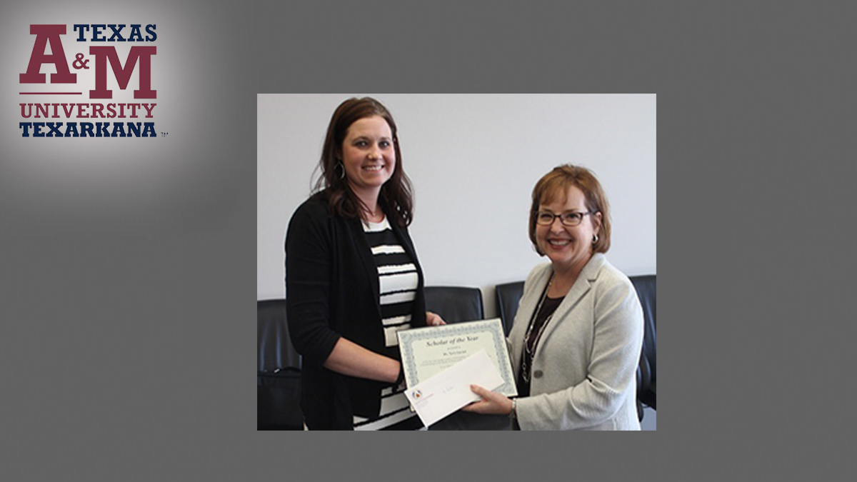 TAMUT recognized faculty members with a Tribute to Scholarship red