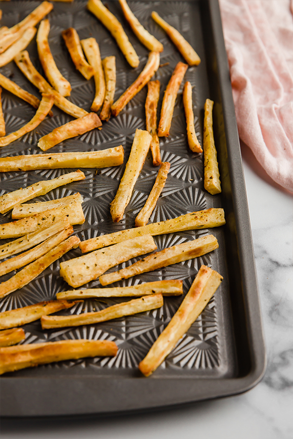 parsnip fries on baking sheet
