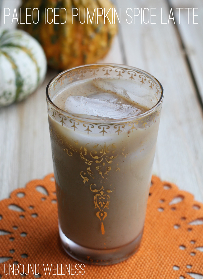 Iced pumpkin spice latte in a white and gold glass