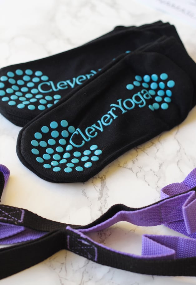 A set of yoga socks sitting on a background.