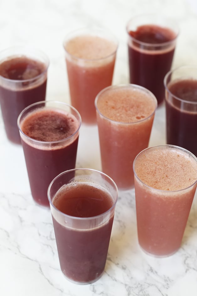8 glasses of kombucha jello shots standing in rows on a counter.