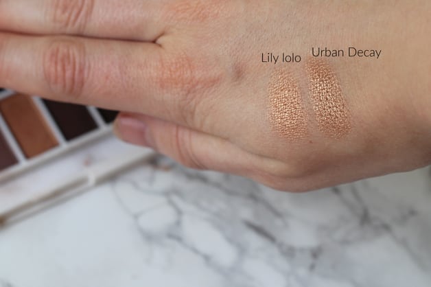 A hand with different makeup colors rubbed on it.