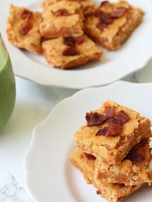 A stack of sweet potato bacon bars sitting on a plate.