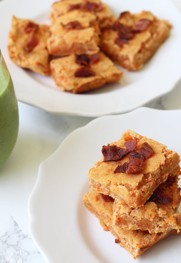 A stack of sweet potato bacon bars sitting on a plate.