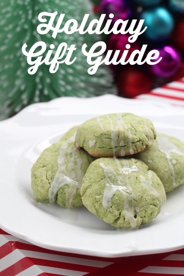 A plate of green cookies with frosting on it below text saying \"holiday gift guide\"