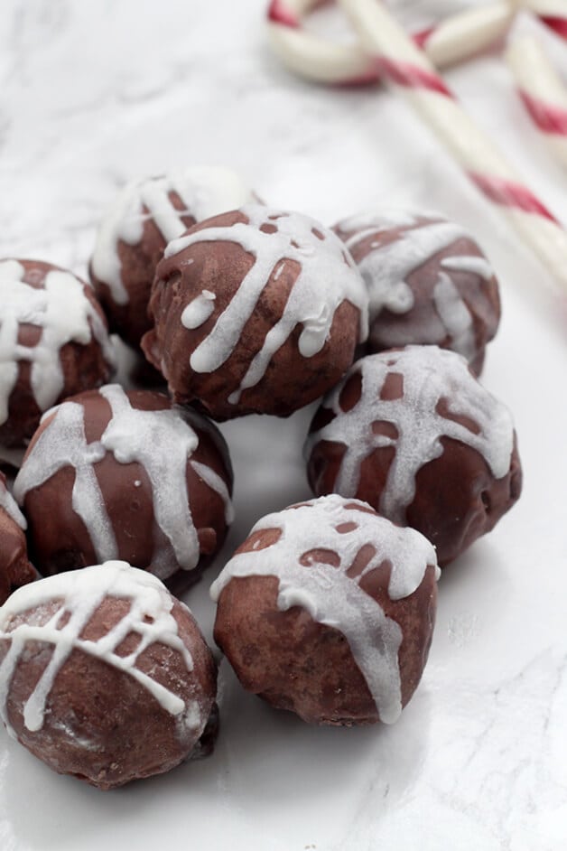 A stack of peppermint truffles sitting on a plate.