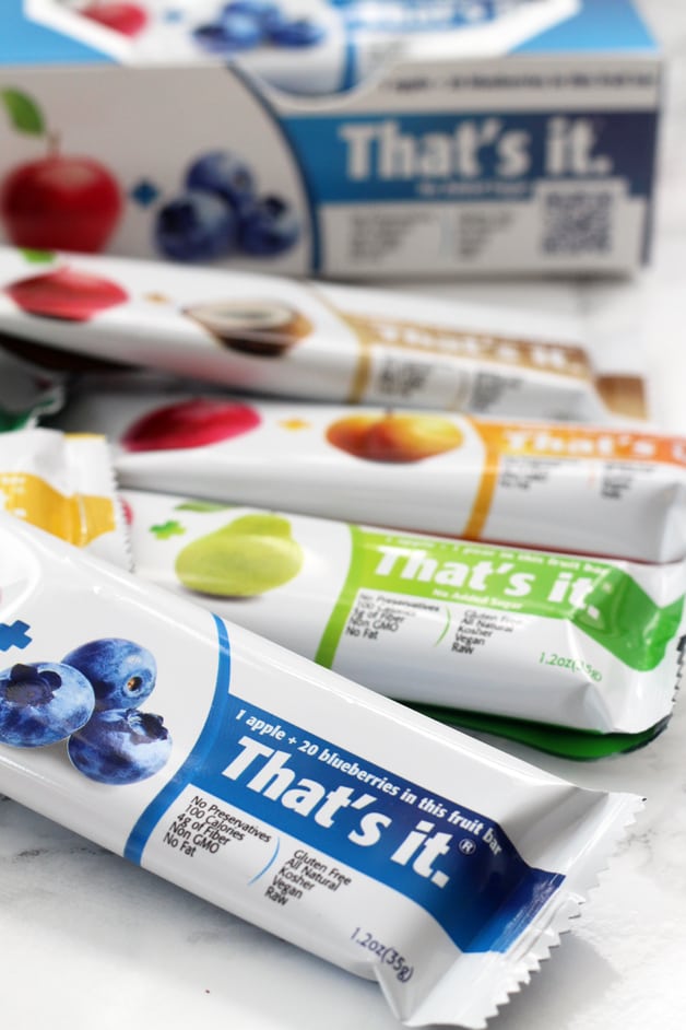Various flavors of That\'s Its bars in a pile.