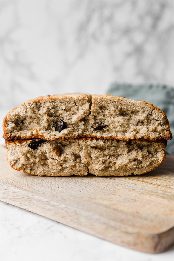 Two slices of Irish soda bread on top of two other slices of Irish soda bread.
