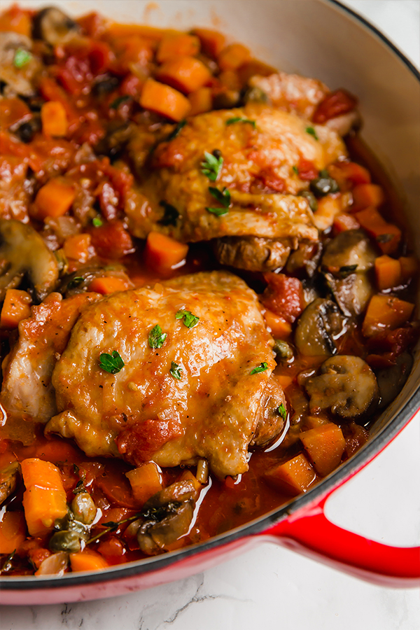 Chicken cacciatore in a pan.
