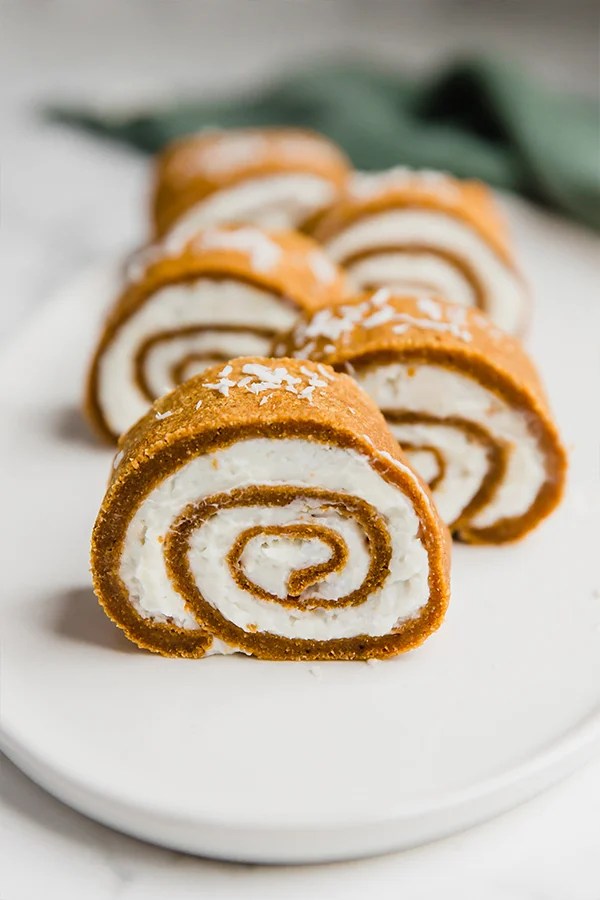 Plate with several slices of pumpkin roll.