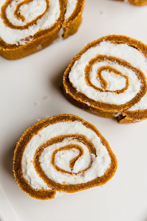 Slices of pumpkin roll on a counter.