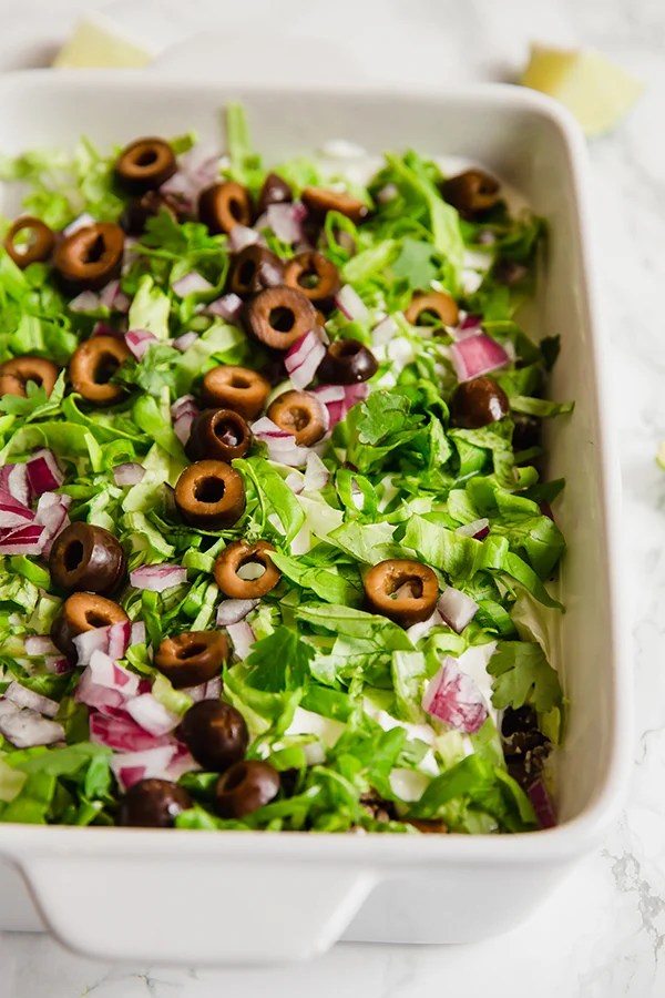 A white baking dish filled with paleo taco dip.