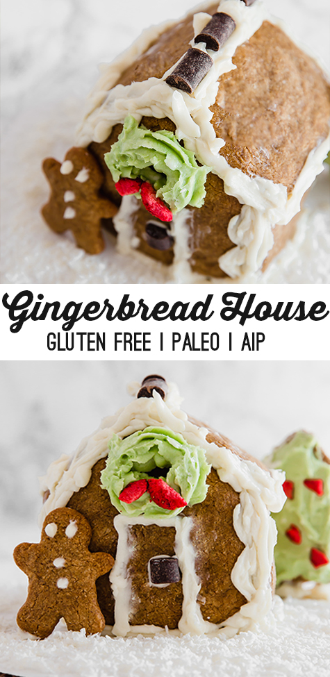 A homemade gingerbread house with a gingerbread man leaning against it and text reading \"gingerbread house gluten free paleo aip\"