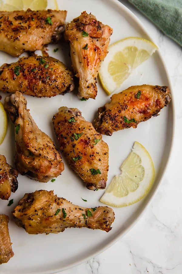 Lemon pepper wings on a plate.