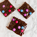 Three cosmic brownies sitting on a counter.
