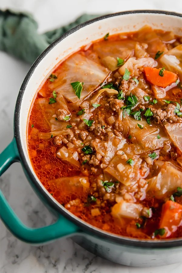 A Dutch oven filled with cabbage roll soup after cooking before being eaten.