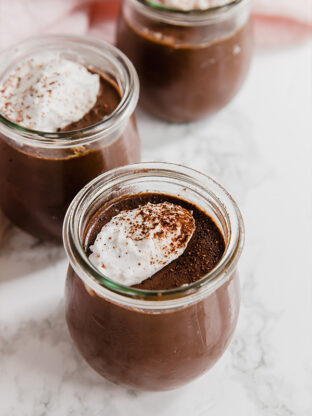 A few glass jars filled with homemade chocolate pudding.