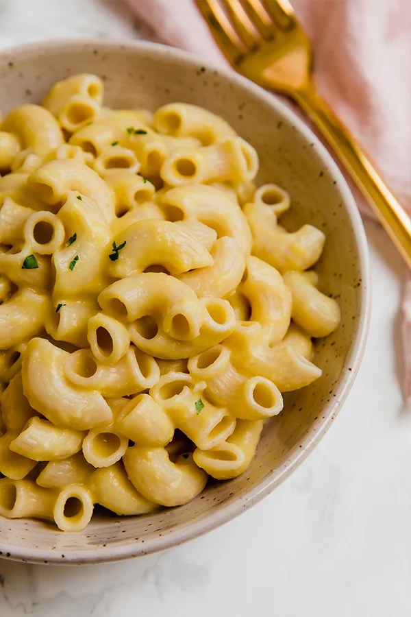 A white bowl filled with AIP mac and cheese.