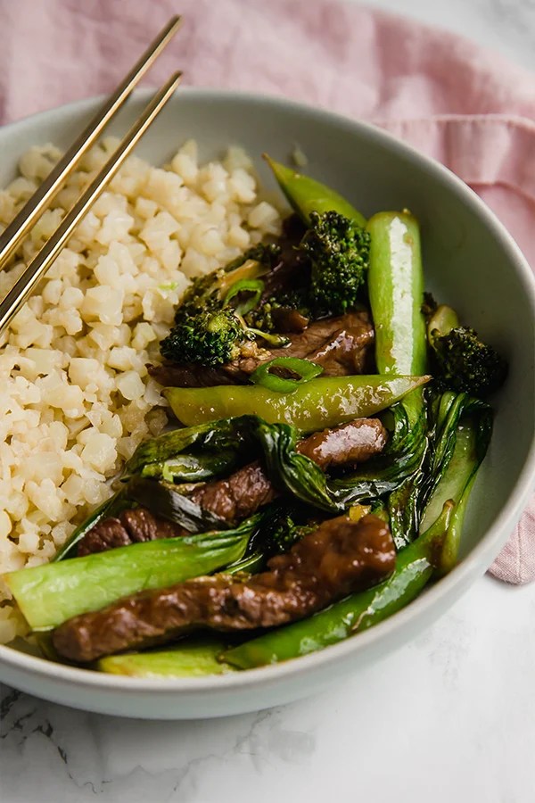 Beef stir fry in bowl with cauliflower rice
