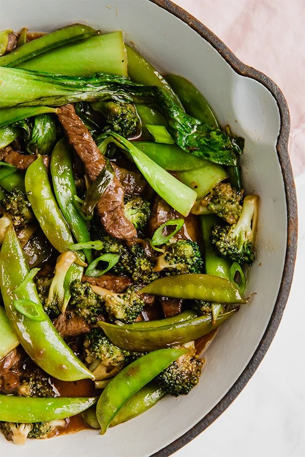 A baking dish filled with ginger beef stir fry after cooking.
