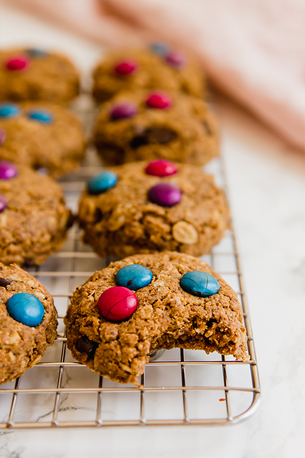 Monster cookies on a cooling rack