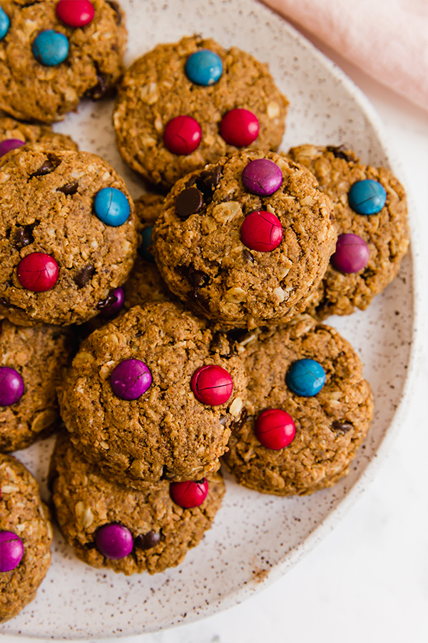 A white plate filled with gluten free monster cookies.