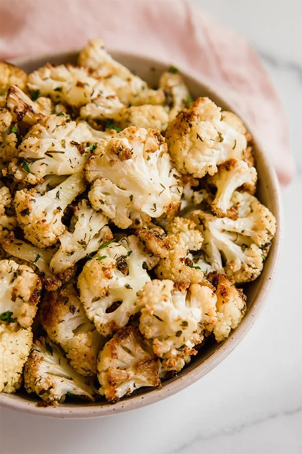 A white bowl filled with ranch roasted cauliflower.