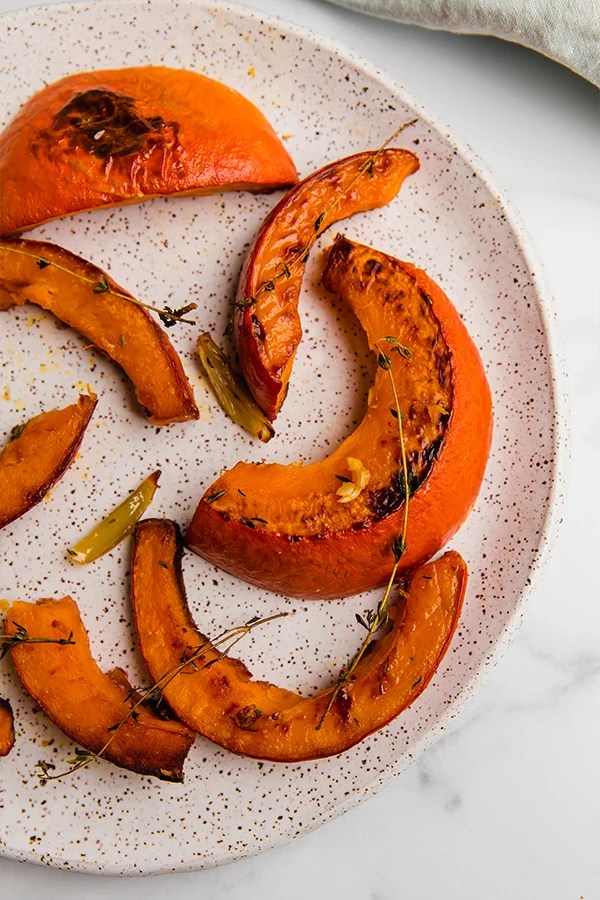 roasted red kuri squash slices on plate