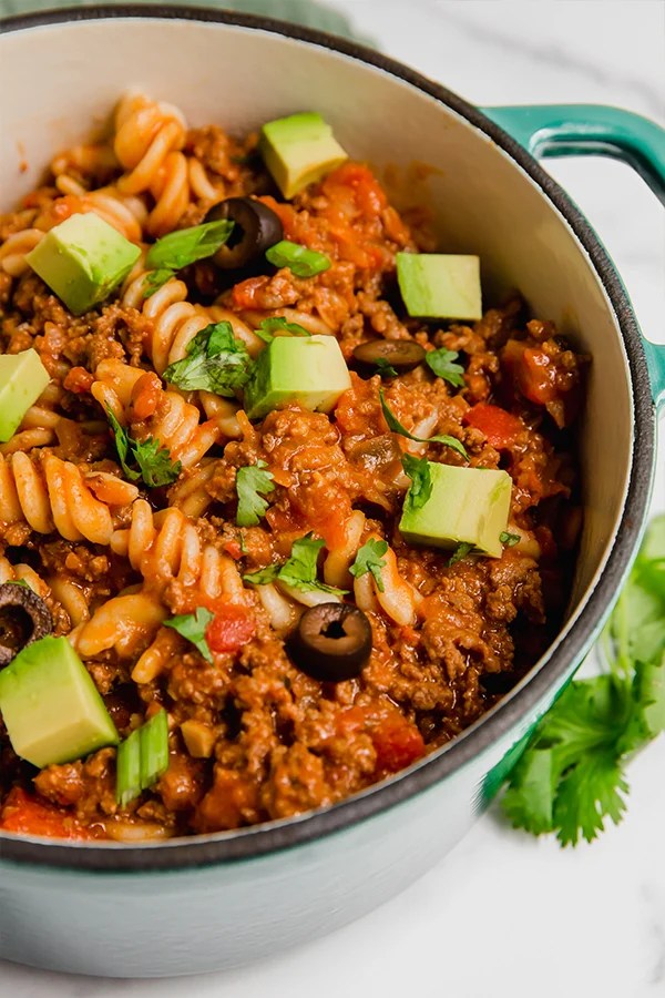 A Dutch oven filled with paleo taco pasta.