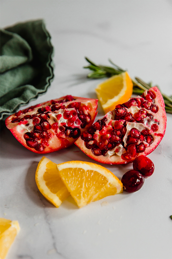 sliced pomegranates and oranges