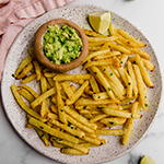 Jicama fries on a plate with dip.