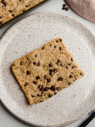 slice of sheet pan chocolate chip cookie on plate