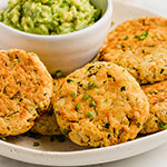 baked veggie nuggets on a plate with a side of guacamole.