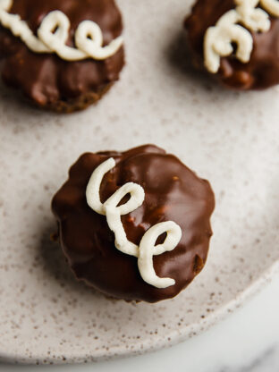 Copycat ding dong cupcake topped with a swirl of icing.