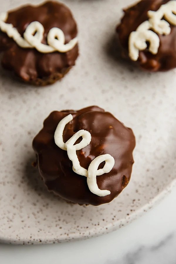 Copycat ding dong cupcake topped with a swirl of icing.