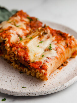 Plate of lasagna roll ups.