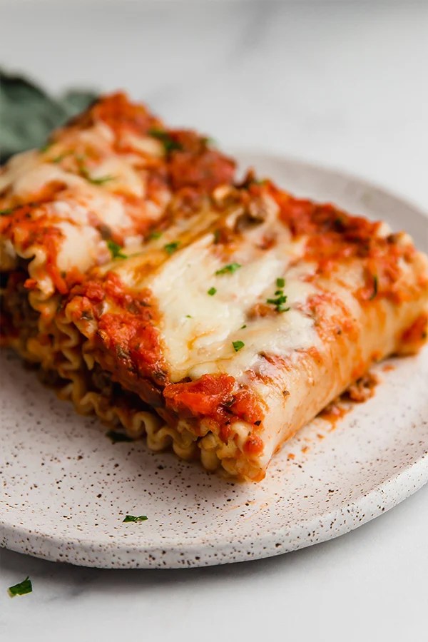 Plate of lasagna roll ups.