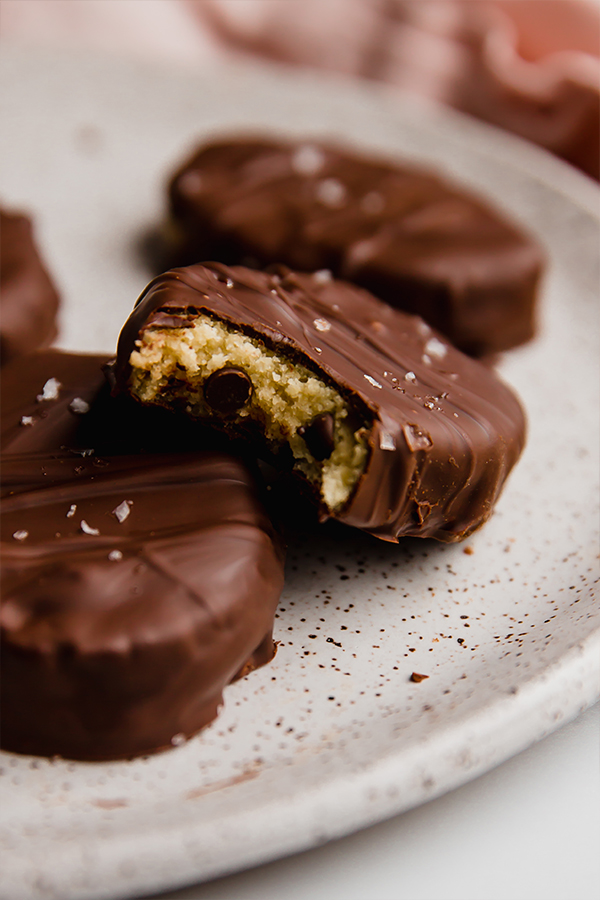 chocolate covered eggs with a bite