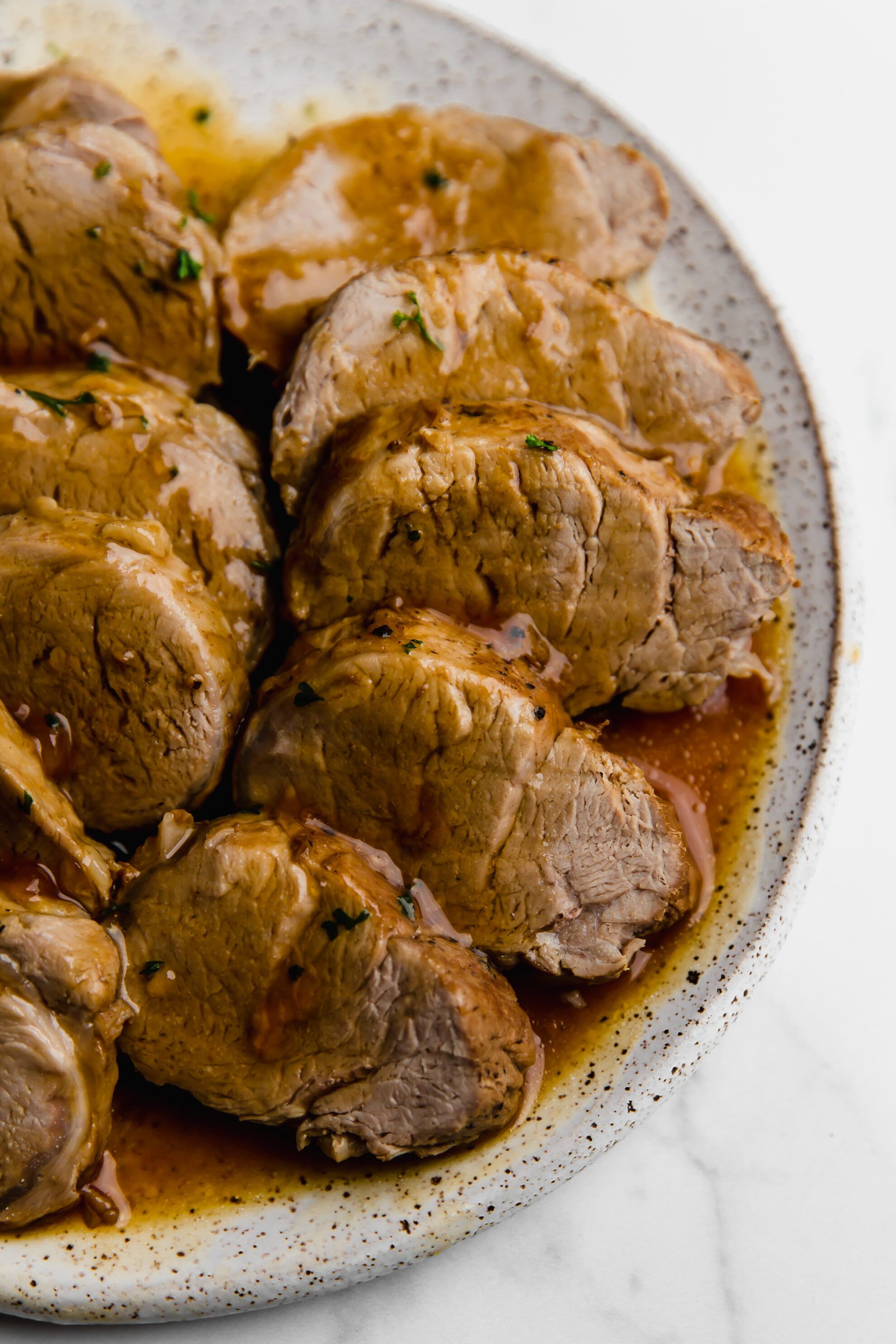 Plate of sliced pork tenderloin.