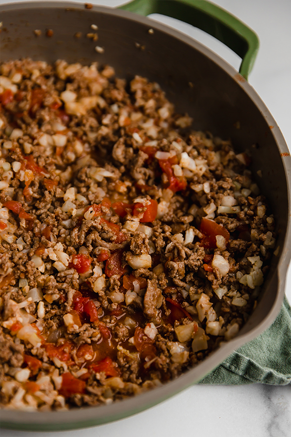 ground beef and cauliflower rice in a pan
