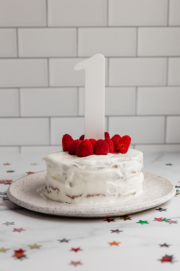 baby smash cake with raspberries and cake topper