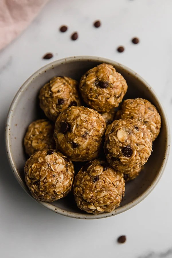 No bake energy bites piled in a bowl.