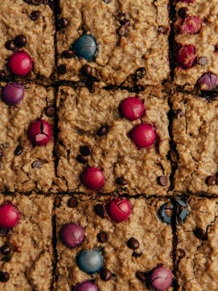 Monster cookie oatmeal breakfast bars cut into squares.