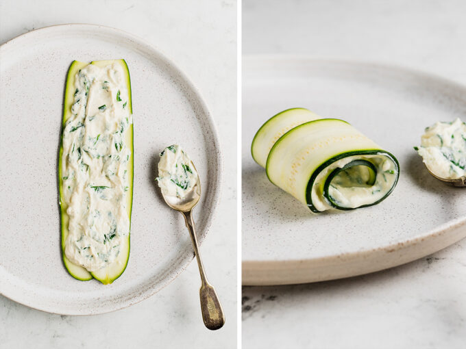 Slices of zucchini with ricotta cheese spread on and rolled up