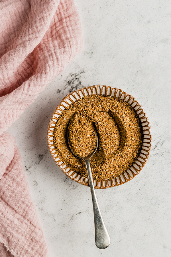 Spice rub mixed in a bowl with a spoon