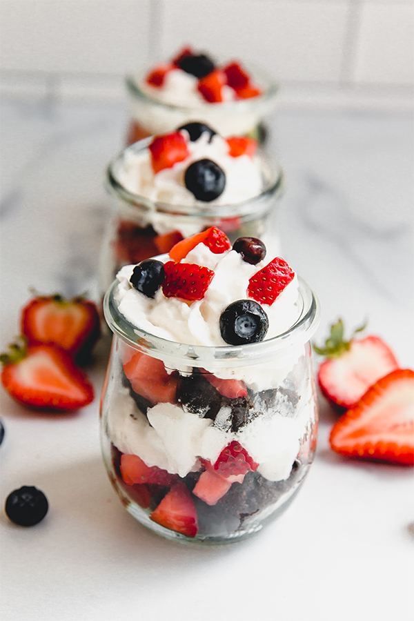 Glasses of brownie berry parfaits.