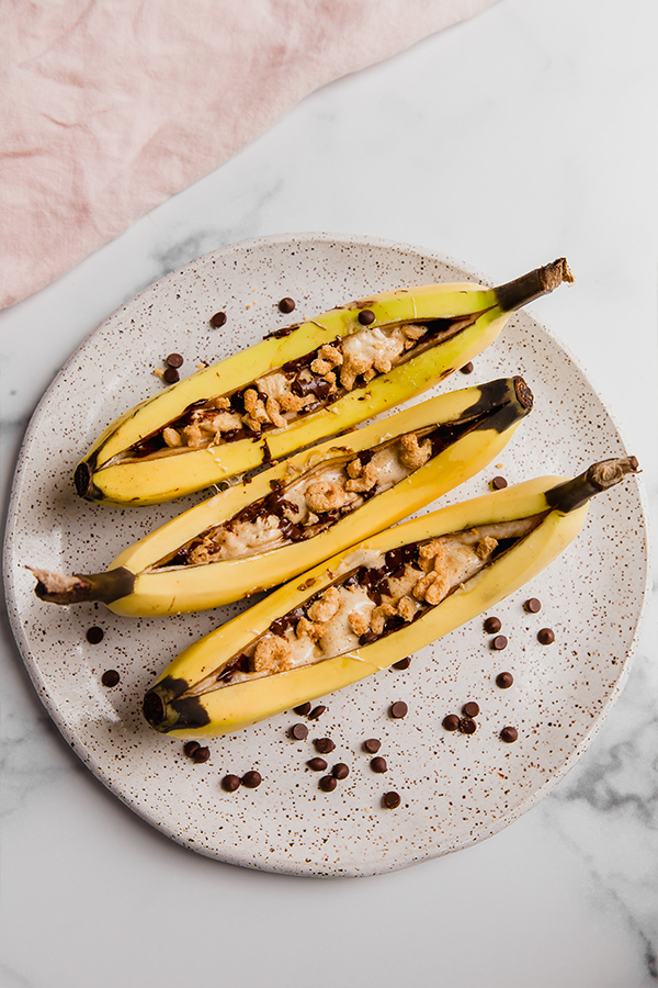 Three campfire bananas on a plate.