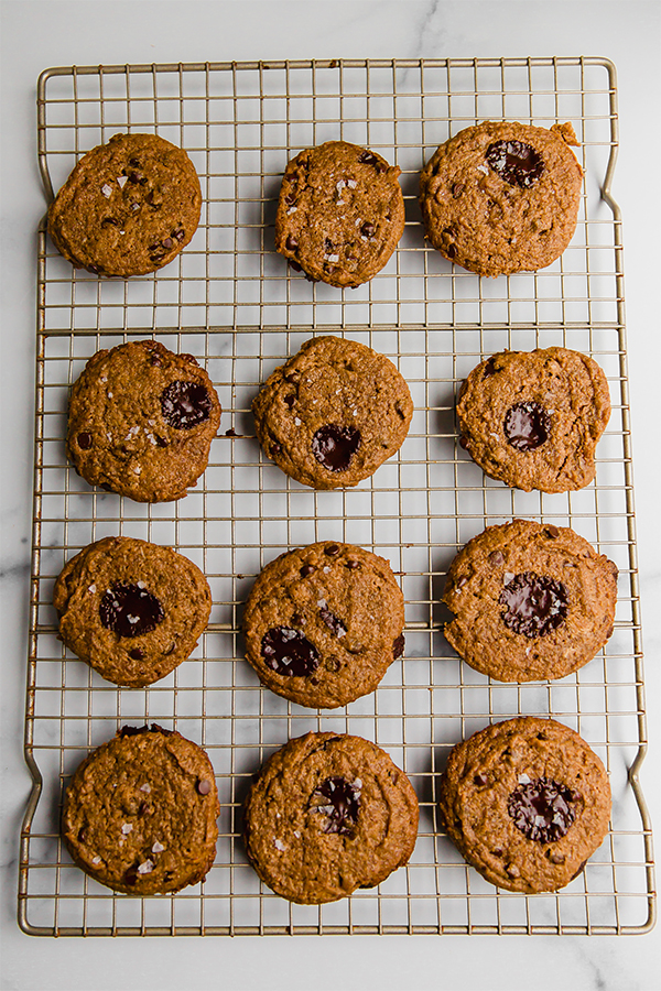 Top view of baked flourless almond butter cookies on a cooling rack