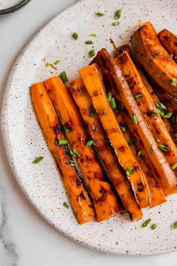 Sweet potato fries grilled and served on a plate